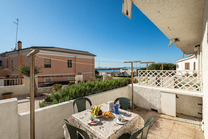 [ "LUNGOMARE SCOGLIO LUNGO APARTMENT" // PORTO TORRSE ]